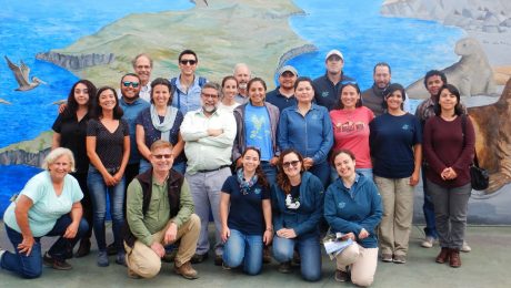 SWG poses at the GECI office mural in Ensenada, MX.