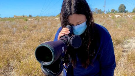 Johana Nieblas observing waterbirds in the wetland ''Laguna la Cruz'' (photo by Lauren Dolinski).